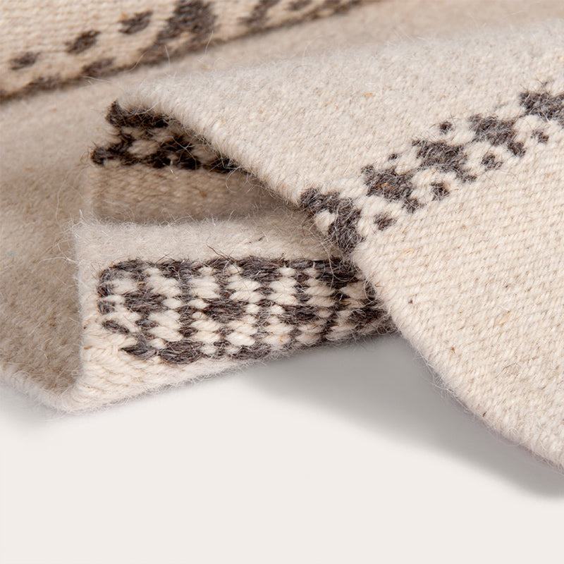 Il Volo Sardinian handwoven cream wool rug and tapestry by Anna Deriu, woven on a traditional Sardinian horizontal loom.