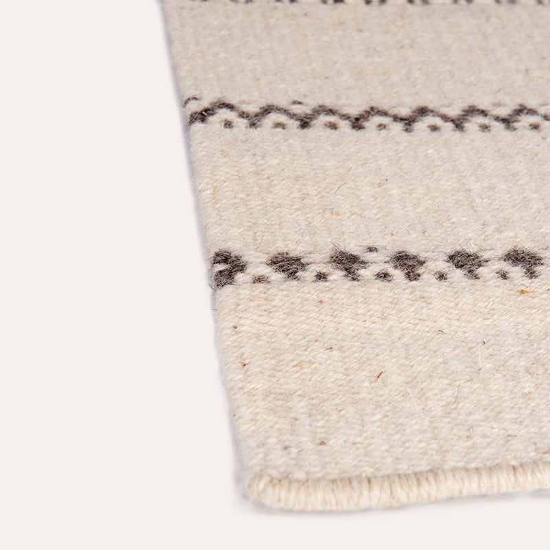 Il Volo Sardinian handwoven cream wool rug and tapestry by Anna Deriu, woven on a traditional Sardinian horizontal loom.