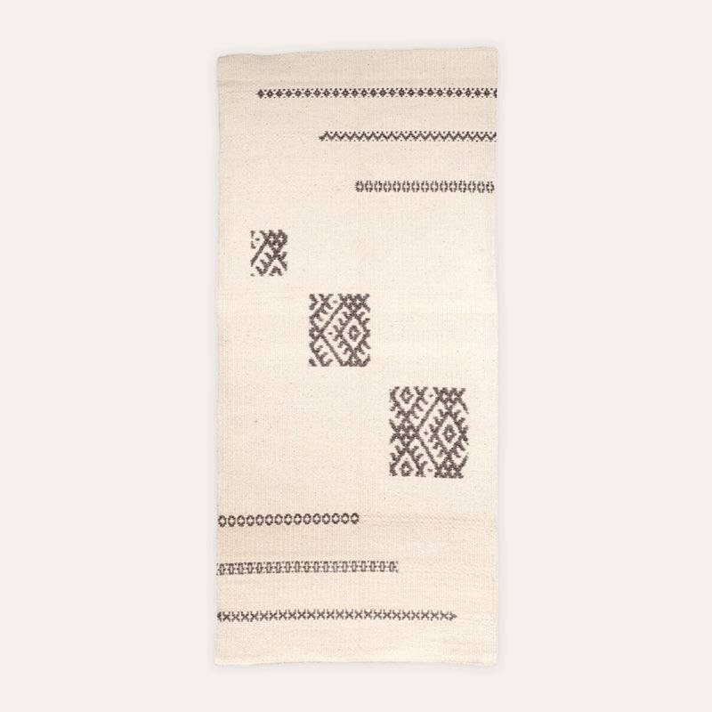 Il Volo Sardinian handwoven cream wool rug and tapestry by Anna Deriu, woven on a traditional Sardinian horizontal loom.