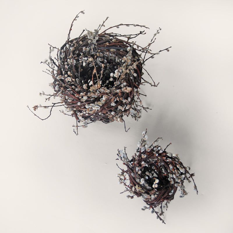 Handwoven pair of catkin nest sculptures by Irish artisan Joe Hogan, created from grey willow catkins gathered from the Irish landscape.
