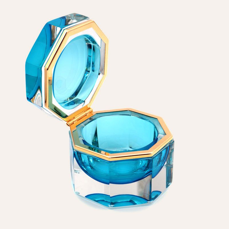 Medium octagonal light-blue Murano glass jewelry box with 24K gold metal detailing and polished surfaces, handcrafted on Murano Island in Venice, Italy.