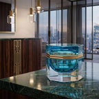 Medium octagonal light-blue Murano glass jewelry box with 24K gold metal detailing and polished surfaces, handcrafted on Murano Island in Venice, Italy.