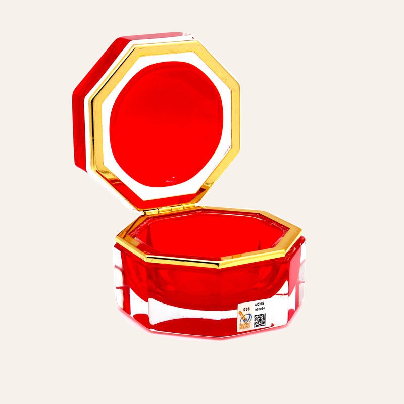 Medium octagonal red Murano glass jewelry box with 24K gold metal detailing and polished surfaces, handcrafted on Murano Island in Venice, Italy.