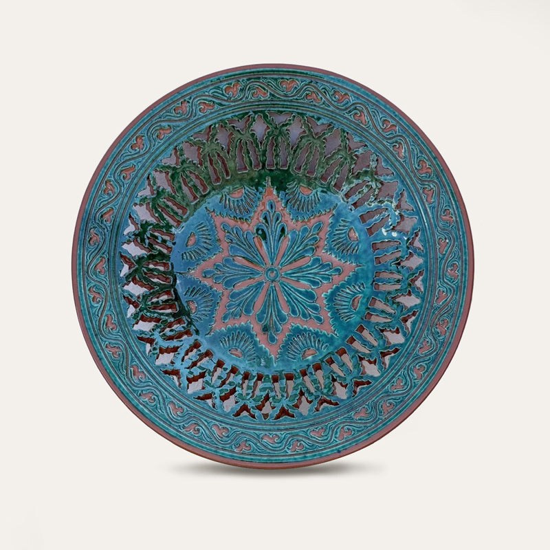 Plato Calado Estrella openwork ceramic wall plate by Pablo Tito with green and brown tones, featuring an intricate star motif, handcrafted in Andalusia, Spain.
