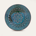 Plato Calado Estrella openwork ceramic wall plate by Pablo Tito with green and brown tones, featuring an intricate star motif, handcrafted in Andalusia, Spain.