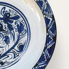 Plato Renacentista hand-painted ceramic wall plate by Pablo Tito with blue and white decorative motifs, handcrafted in Andalusia, Spain.