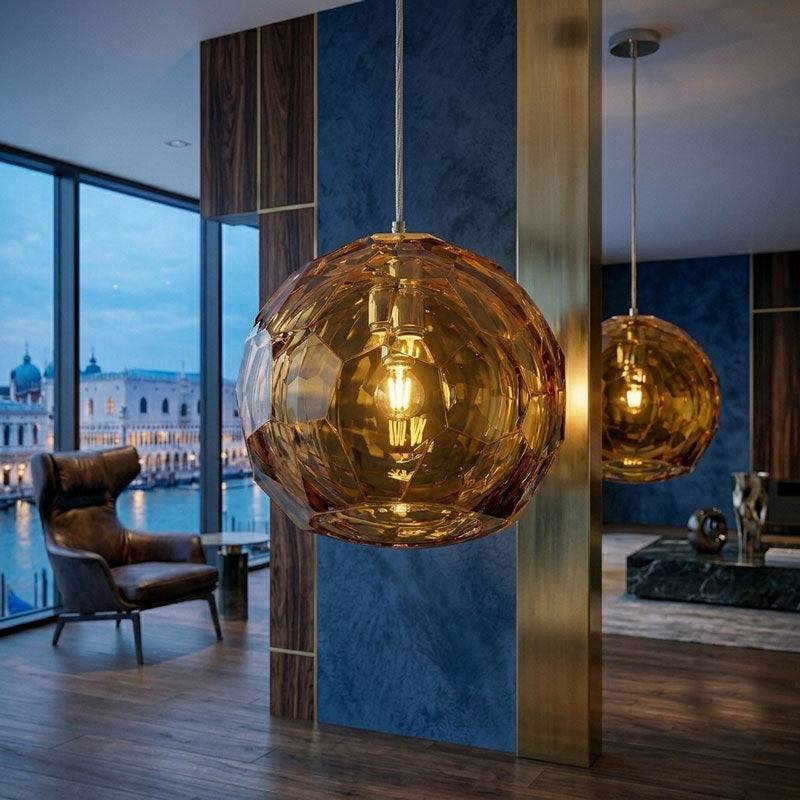 Medium amber spherical Murano glass pendant lamp with a hand-sculpted faceted surface, handcrafted on Murano Island in Venice, Italy.