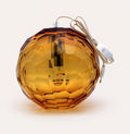 Small amber spherical Murano glass pendant lamp with a hand-sculpted faceted surface, handcrafted on Murano Island in Venice, Italy.