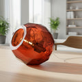 Small dark amber spherical Murano glass table lamp with a hand-sculpted faceted surface, handcrafted on Murano Island in Venice, Italy.