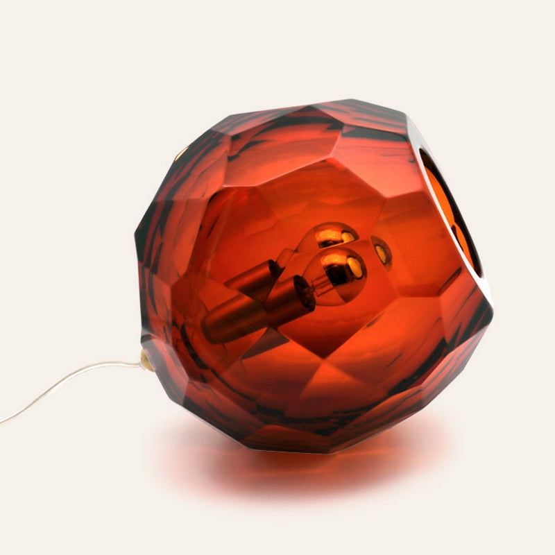 Small dark amber spherical Murano glass table lamp with a hand-sculpted faceted surface, handcrafted on Murano Island in Venice, Italy.