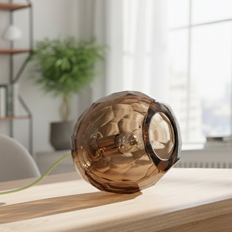Small tobacco spherical Murano glass table lamp with a hand-sculpted faceted surface, handcrafted on Murano Island in Venice, Italy.