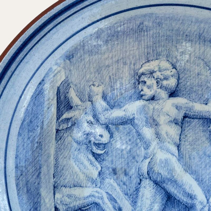 Toros de Gerión hand-painted ceramic wall plate by Pablo Tito with blue and white decorative motifs, handcrafted in Andalusia, Spain.