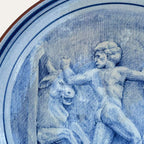 Toros de Gerión hand-painted ceramic wall plate by Pablo Tito with blue and white decorative motifs, handcrafted in Andalusia, Spain.