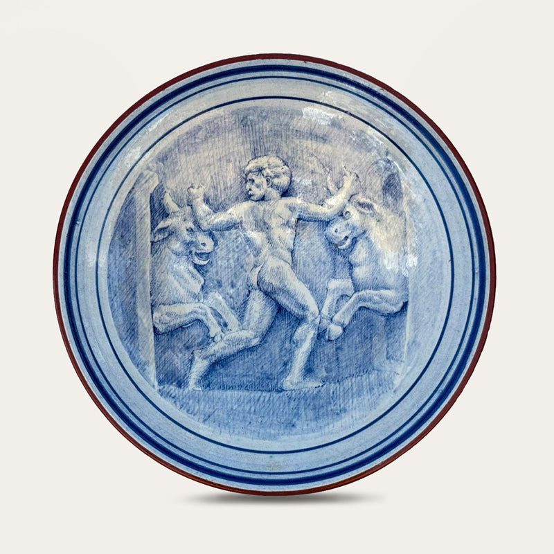 Toros de Gerión hand-painted ceramic wall plate by Pablo Tito with blue and white decorative motifs, handcrafted in Andalusia, Spain.