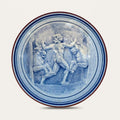 Toros de Gerión hand-painted ceramic wall plate by Pablo Tito with blue and white decorative motifs, handcrafted in Andalusia, Spain.
