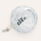 Medium crystal spherical Murano glass table lamp with a hand-sculpted faceted surface, handcrafted on Murano Island in Venice, Italy.