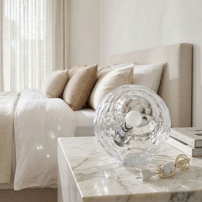 Medium crystal spherical Murano glass table lamp with a hand-sculpted faceted surface, handcrafted on Murano Island in Venice, Italy.