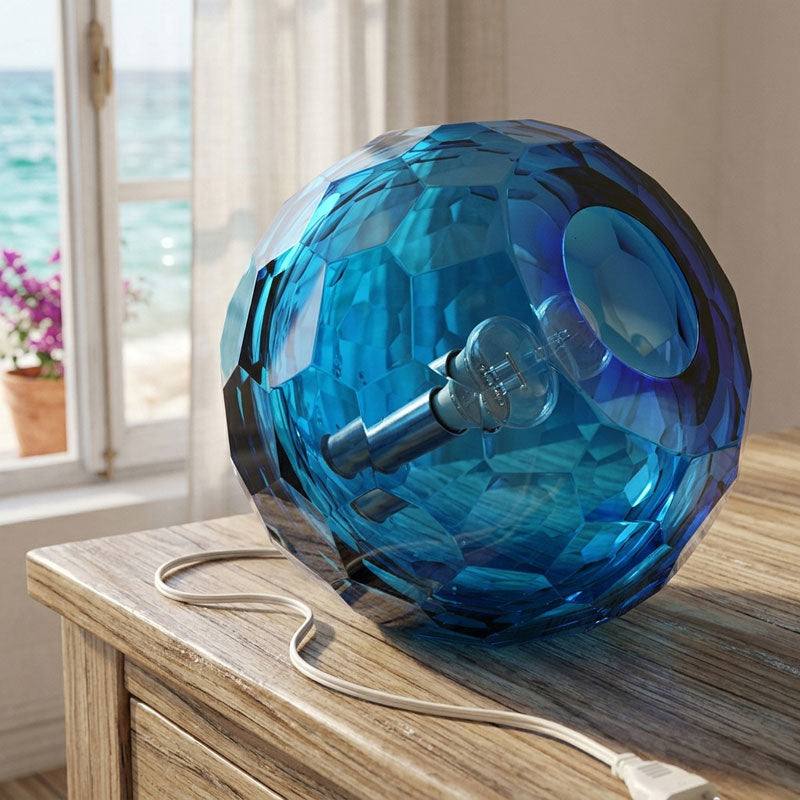Medium grey spherical Murano glass table lamp with a hand-sculpted faceted surface, handcrafted on Murano Island in Venice, Italy.